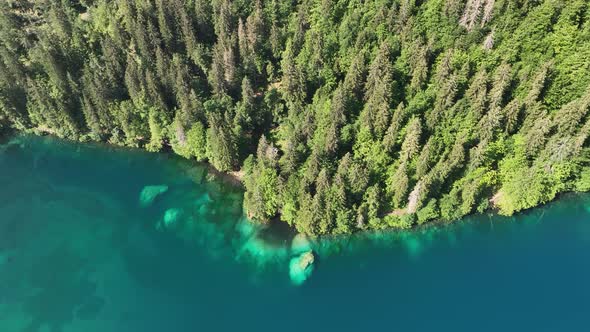 Emerald lake at Fusine with Mangart mountain