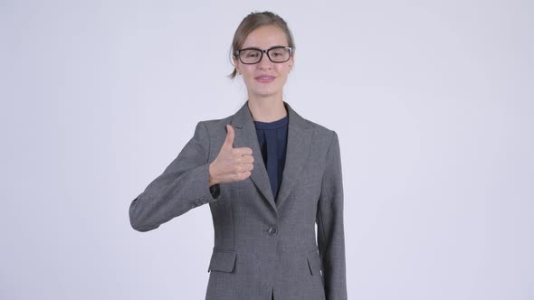 Young Happy Businesswoman Giving Thumbs Up
