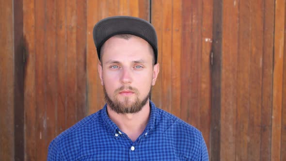 Close Up Portrait of Bearded Serious Man Looking At Camera