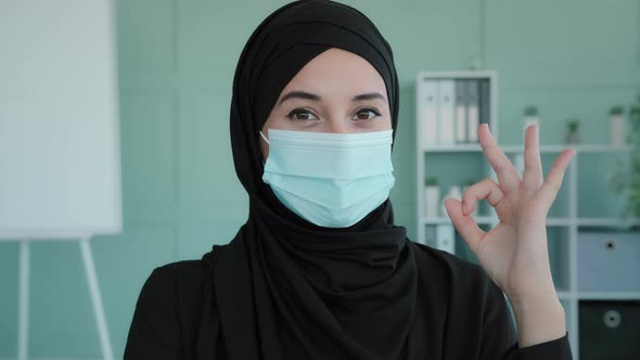 Female Portrait in Office Islamic Successful Businesswoman in Black Hijab Wears Medical Mask Arab