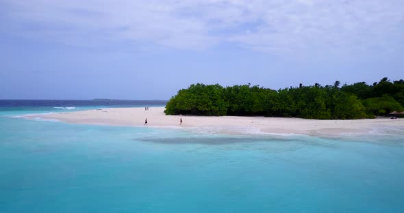 Tropical drone clean view of a white paradise beach and aqua blue ocean background in high resolutio