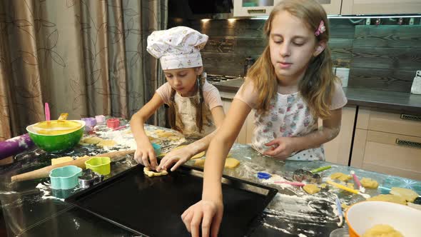 Two girls making cookies