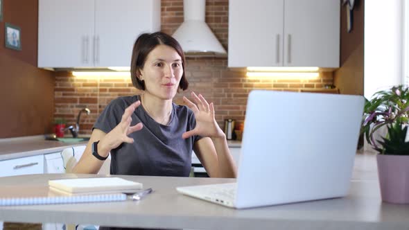 Female Blogger is Recording Video with Webcam of Laptop