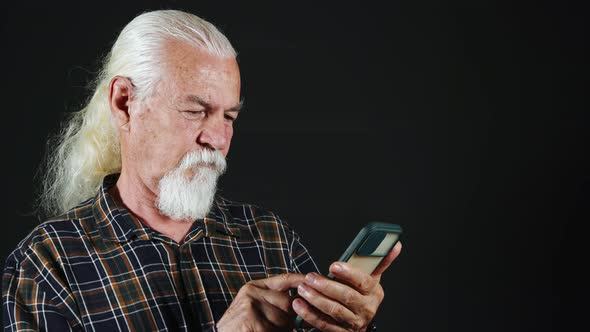 Man Watching Something On The Phone On The Internet