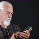 Man Watching Something On The Phone On The Internet - VideoHive Item for Sale