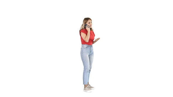 Young woman talking on mobile phone on white background.