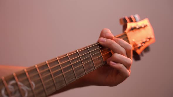 Musician plays beautiful acoustic guitar