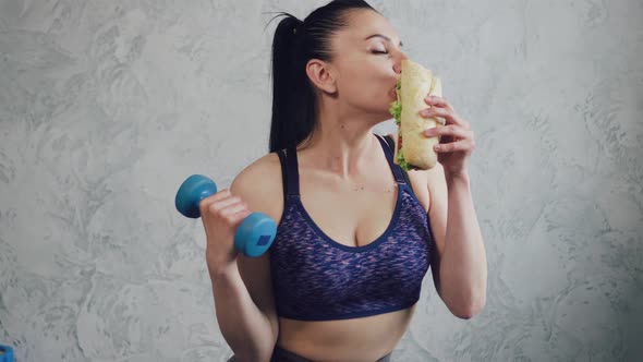 Athletic Woman Eating Junk Food