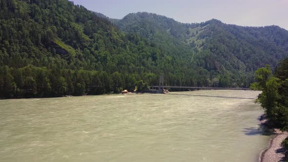 Aerial: Flying Over Mountain River, Car Bridge