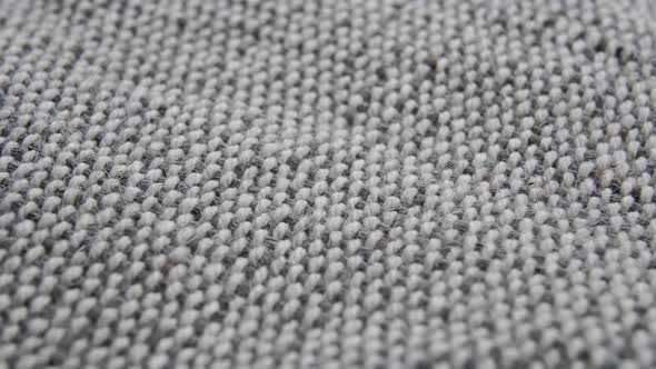 Grey burlap jute canvas texture background. Macro. Slow rotation