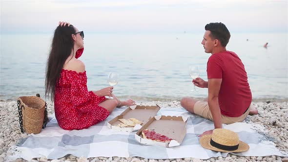 Family Having a Picnic on the Beach