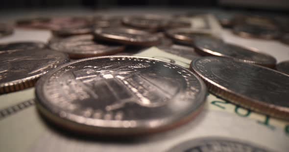 Coins Lie on Paper Bills Closeup