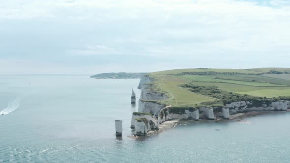 establishing drone shot of Old Harry Rocks Chalk cliffs