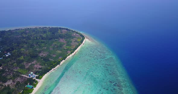 Tropical above island view of a sunshine white sandy paradise beach and turquoise sea background in 