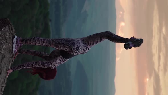 Athletic Woman Stretching Against Stunning Mountain Landscape