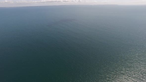 Drone flying over calm sea