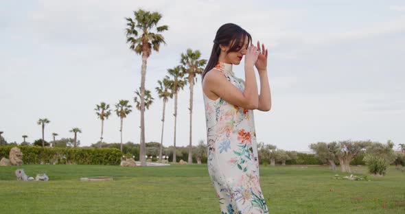 Model with long white dress with flowers