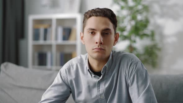 Serious Man Having Online Meeting From Home