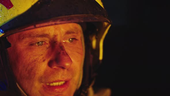 Portrait of Tired Firefigter After Long Hours of Rescuing People From Fire. Close Up, Slow Motion