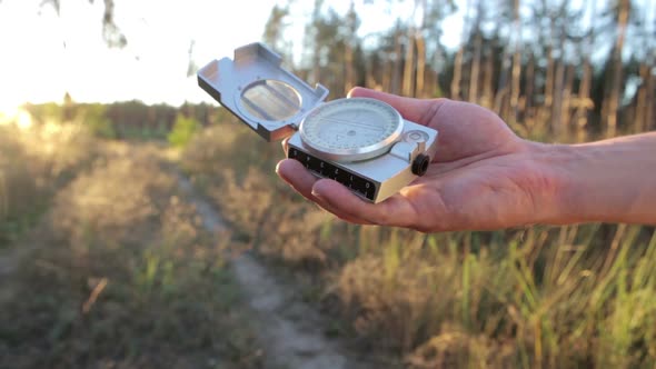 Tourists Enjoy a Compass on a Journey