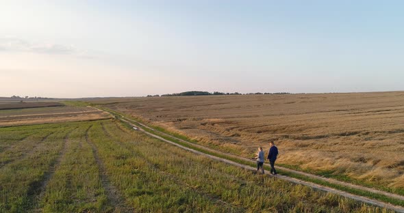 Young Farmers Discussing At Maize Field