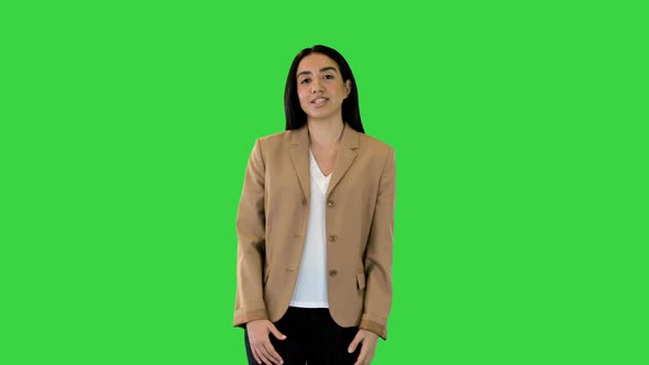 Indian Girl Telling Something Counting on Fingers on a Green Screen Chroma Key