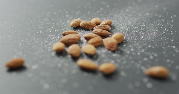 Video of almonds on grey background