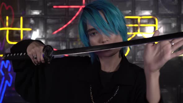 A Young Man with Blue Hair Holds a Katana Sword