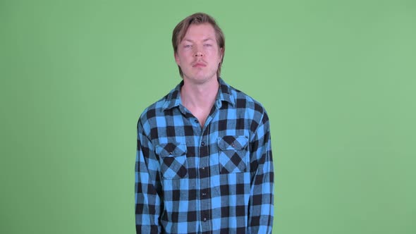 Stressed Young Hipster Man Looking Bored and Tired