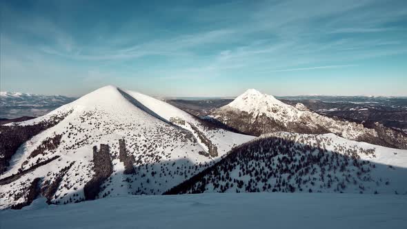 Winter Mountain Landscape on a Sunny Day with Clouds Blue Sky