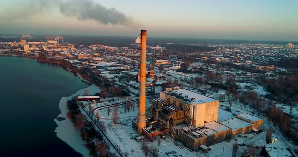 Garbage Incineration Plant in the City at Sunset