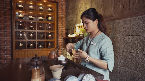 Asian woman preparing tea
