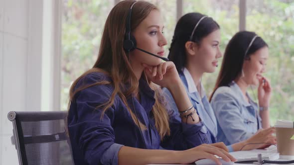 Customer Support Agent or Call Center with Headset Talking to Customer on Phone