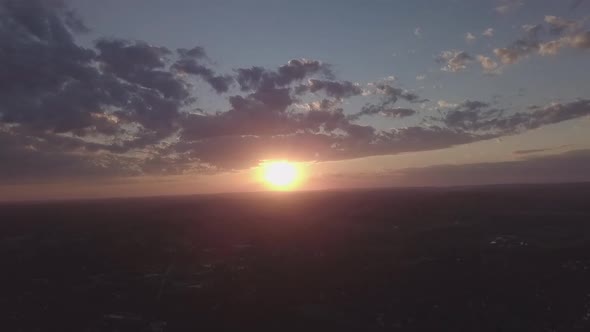 time lapse of small town at sunset