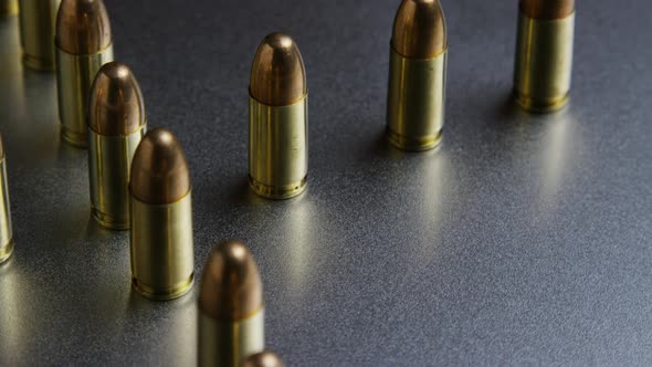 Cinematic rotating shot of bullets on a metallic surface - BULLETS 037