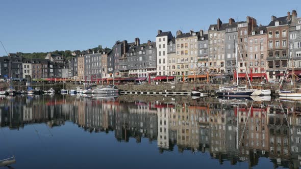 HONFLEUR, FRANCE - SEPTEMBER 2016 Artistic place and port located in northern Normandy by the day wi