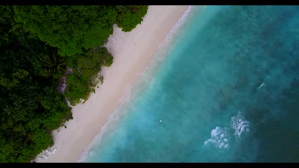 Aerial drone view sky of tropical bay beach lifestyle by aqua blue lagoon with white sandy backgroun