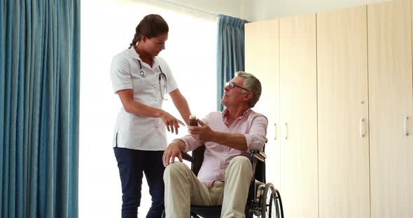 A nurse giving medicament to his patient