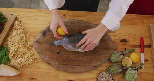 Chef cleaning a fish