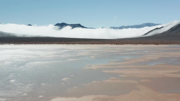 Aerial View of a Drone Flying Over the Flat Wet Cracked Surface of Death Valley