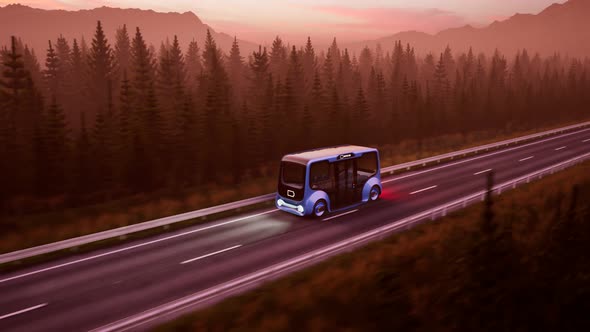 An autonomous electric minibus with a low energy level coming up the road. 4K HD