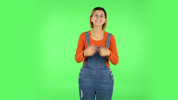 Trendy Girl Poses for Camera Makes Funny Faces. Green Screen