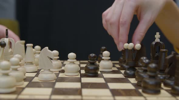 Two Players Make Their Moves in Chess Game Closeup