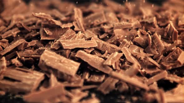 Super Slow Motion Falling of Grated Milk Chocolate