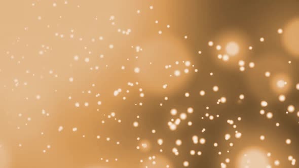 Animation of multiple glowing gold spots of light moving in hypnotic motion on black background alt