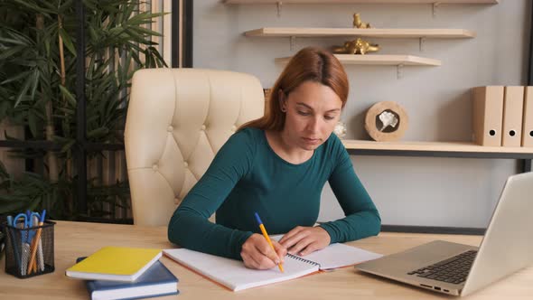 Young Woman Makes Conference Video Call on Laptop Computer