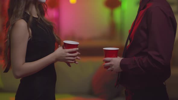 Friends Chatting at Halloween House Party