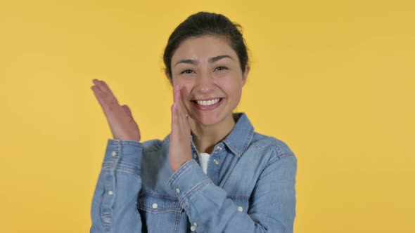 Positive Indian Woman Clapping, Yellow Background 