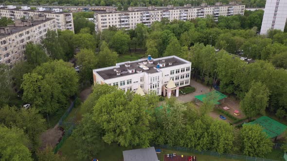 Kindergarten in the Midst of a Green Landscape Aerial View