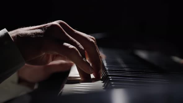 Male Hands Touch Piano Keys and Play Fast Jazz Melody